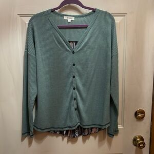 Turquoise long sleeved shirt with printed back